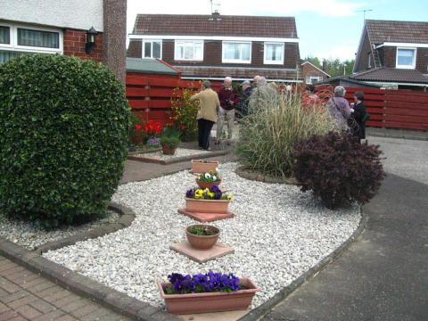 Interested residents visit an attractive Baberton mains front garden