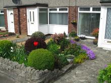 An example of a small packed front garden in Baberton Mains