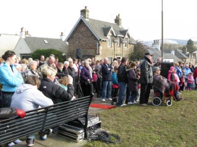 Crowd at the unveiling of the Juniper Green monument